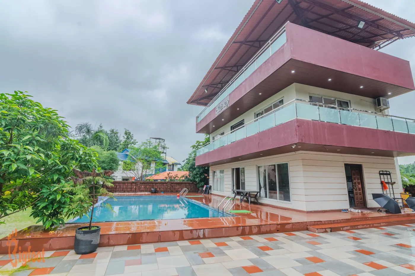 The three levels of Hideaway Villa in Karjat with an open terrace on top and the pool below