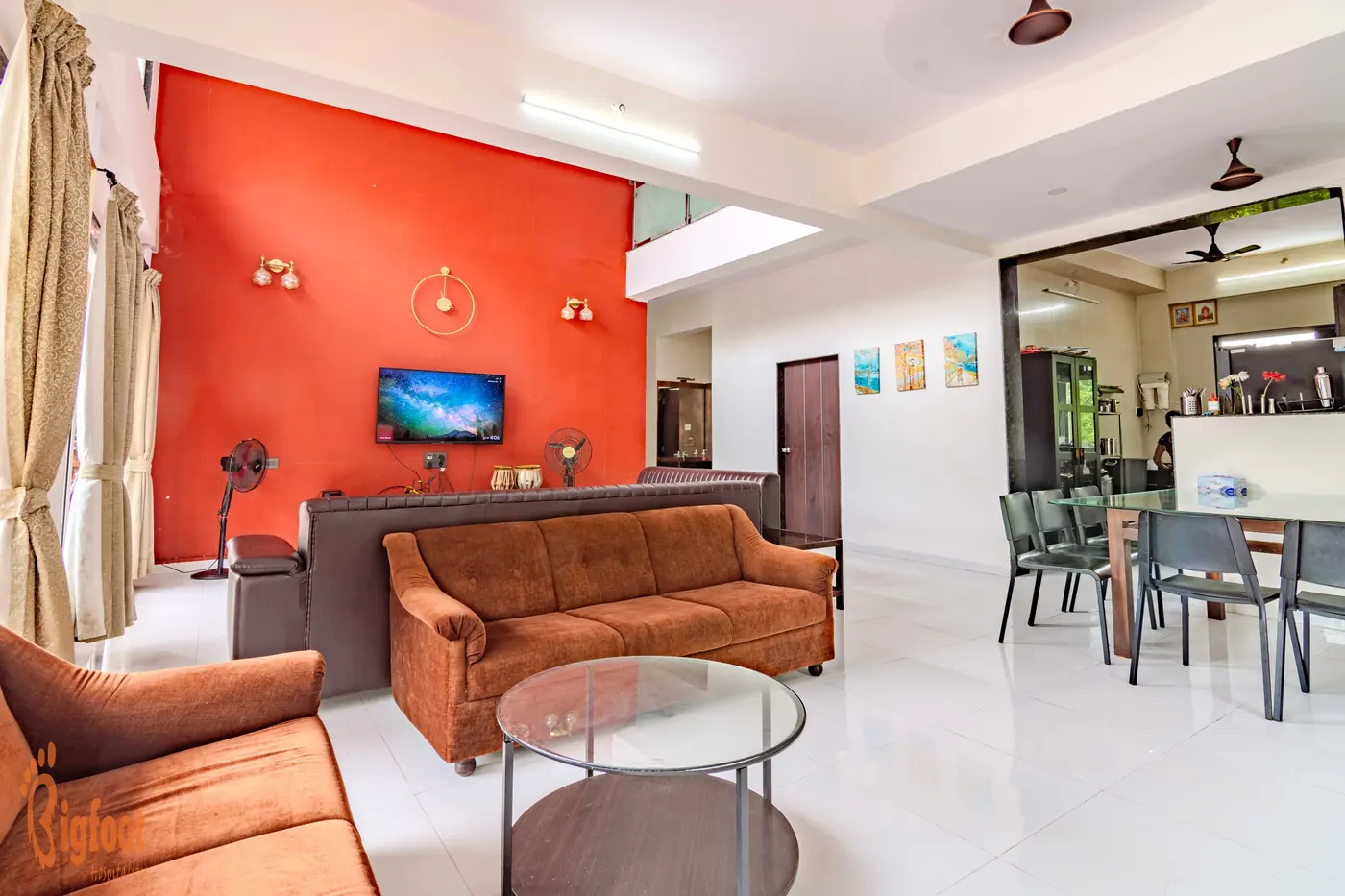 Living and dining area at Hideaway Villa with a terracotta feature wall