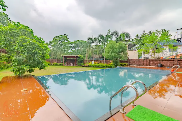 The private swimming pool and lawn at Hideaway Villa