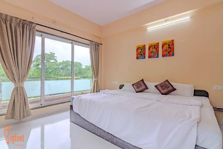 Bedroom at Hideaway Villa decorated with framed artwork